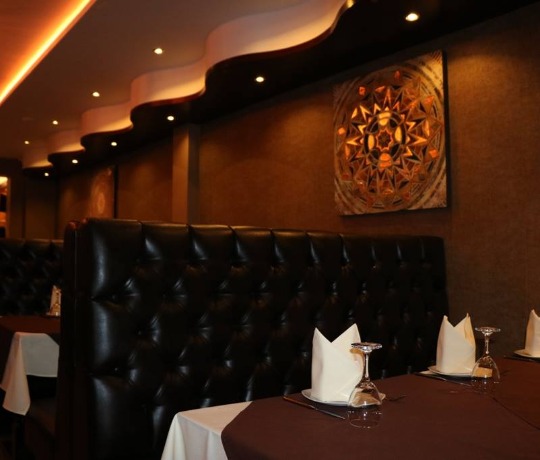 Cosy Indian restaurant with leather booth seating